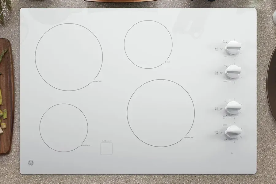 GE white radiant electric cooktop with matching control knobs for serious home chef cooktop features.